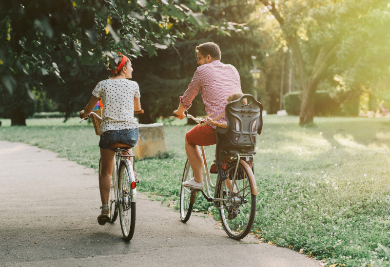 young family riding bicycles